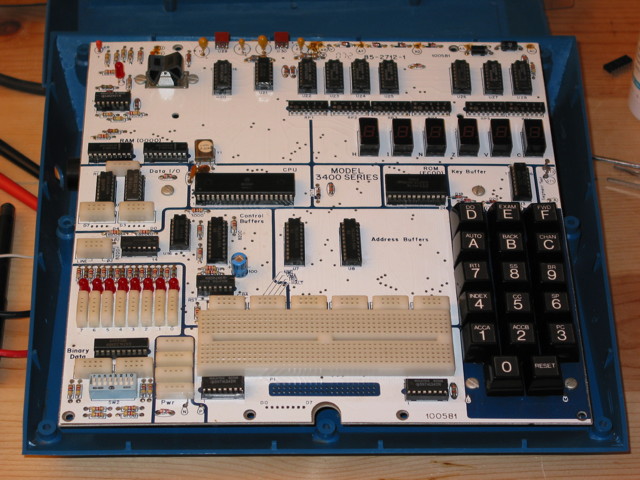A Heathkit ET-3400A Microprocessor trainer with its top case removed.  Some parts of the circuit board are clean and some are dusty.