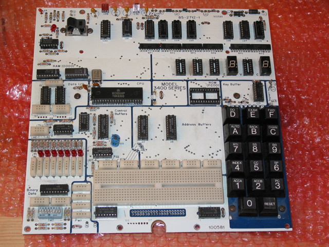 A mostly-populated Heathkit ET-3400A board with no case, all keys present, 4 seven-segment displays missing, ROM missing, and 1 of the 8 red indicator LEDs missing